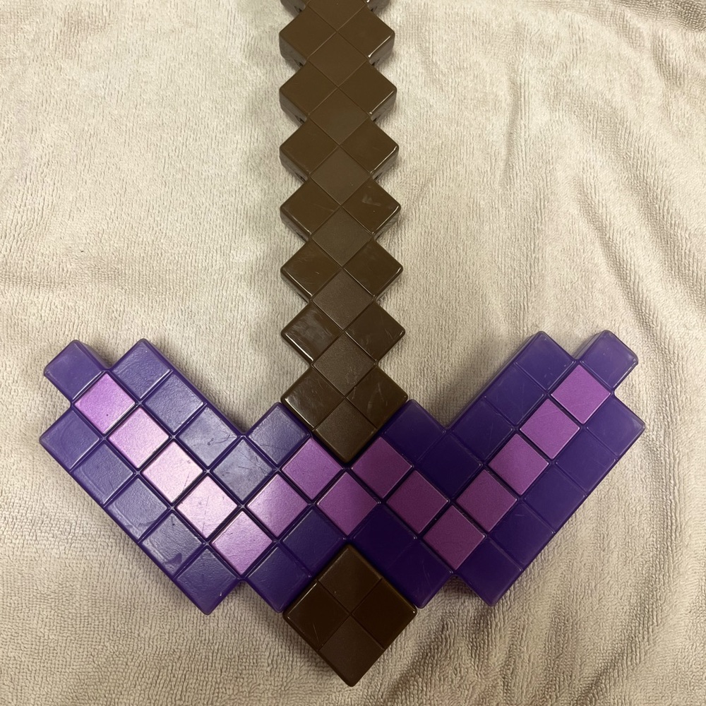 Minecraft pick axe, sword, potion bottle and toy gun